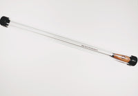Mallet with a white handle and black ends on a light gray background
